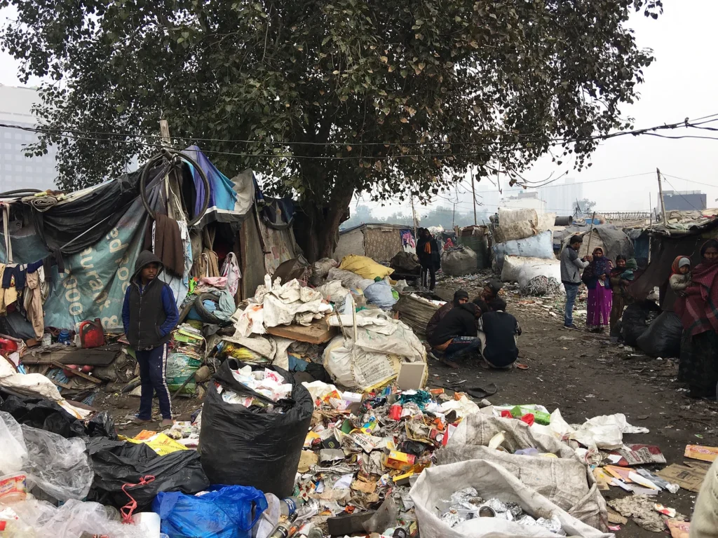About 3,000 people live and work in this community, earning a living by collecting, scavenging, and selling materials from the trash of the surrounding middle class flats. They build homes from found materials, including tarps, metal, and cardboard. Photo by Jessica R. Barnes.