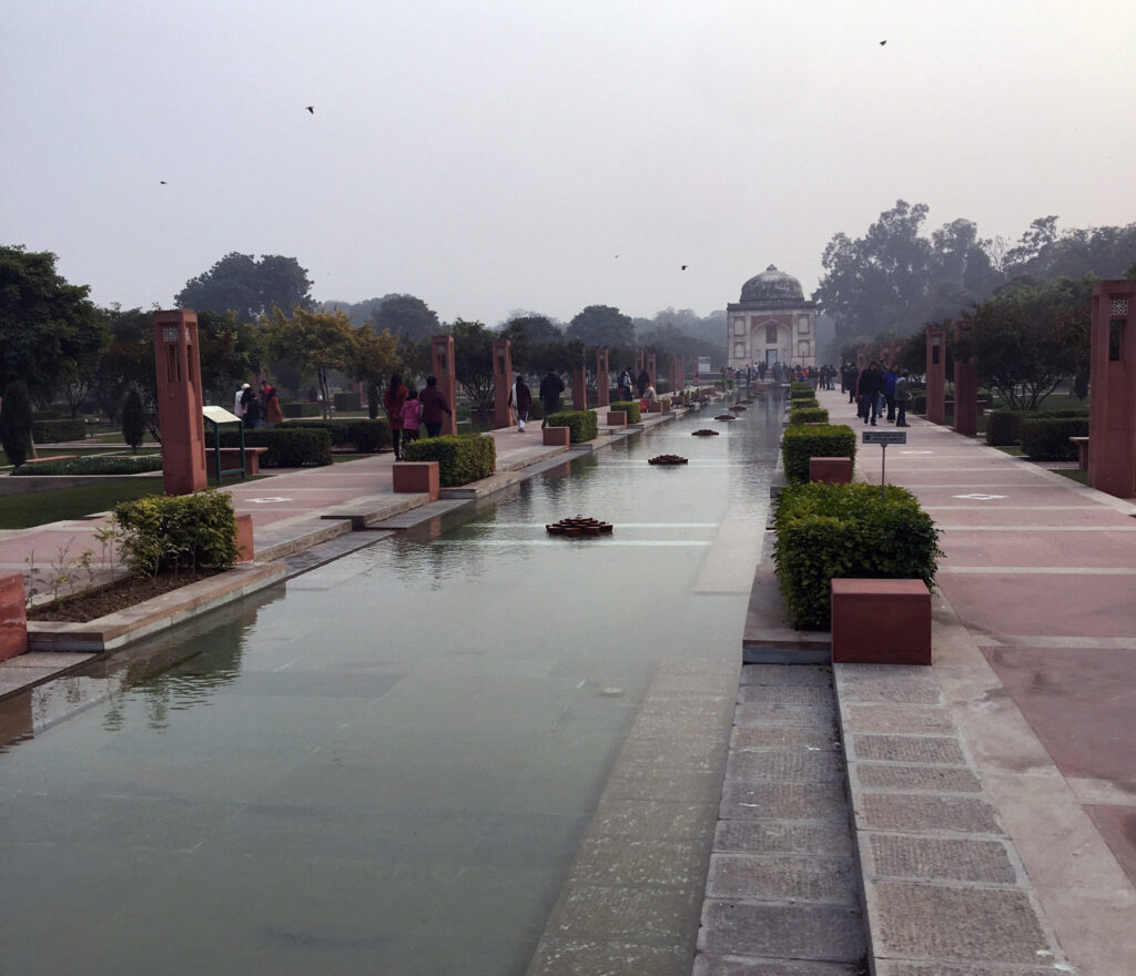Visitors to Humayun's Tomb relax amid the 30-acre Charbagh, Persian-Mughal style garden, and enjoy this beautiful green space in the megacity of Delhi, India. Photo by Jessica R. Barnes.