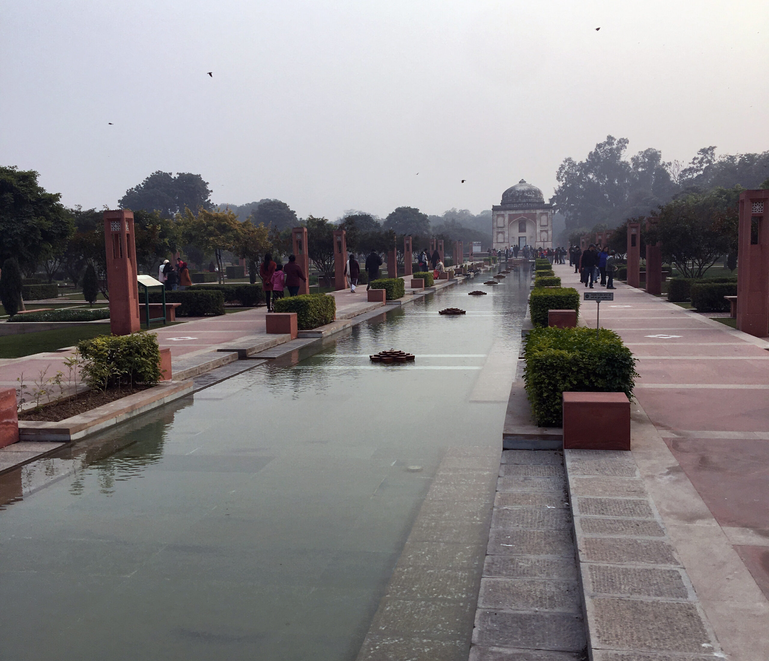 Visitors to Humayun's Tomb relax amid the 30-acre Charbagh, Persian-Mughal style garden, and enjoy this beautiful green space in the megacity of Delhi, India. Photo by Jessica R. Barnes.