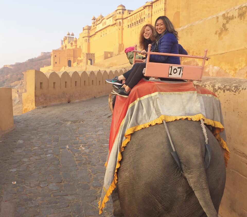 Janet Armitage (left) and Janny Li (right) on a sunrise elephant ride to Amber Fort in Jaipur.